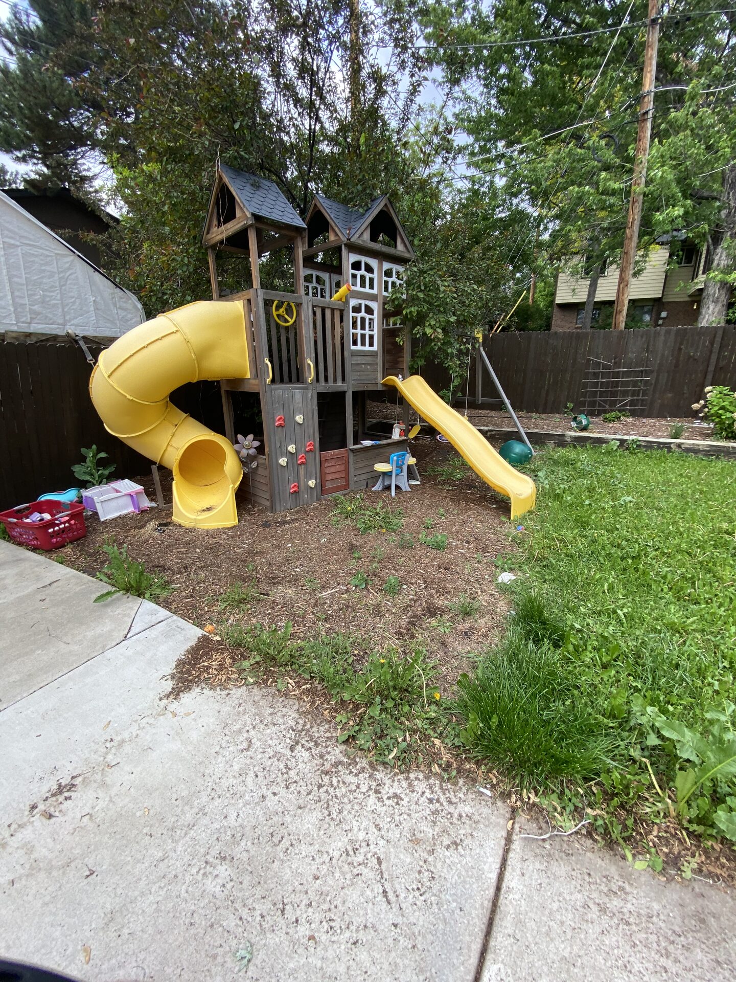 Backyard play area before cleanup work