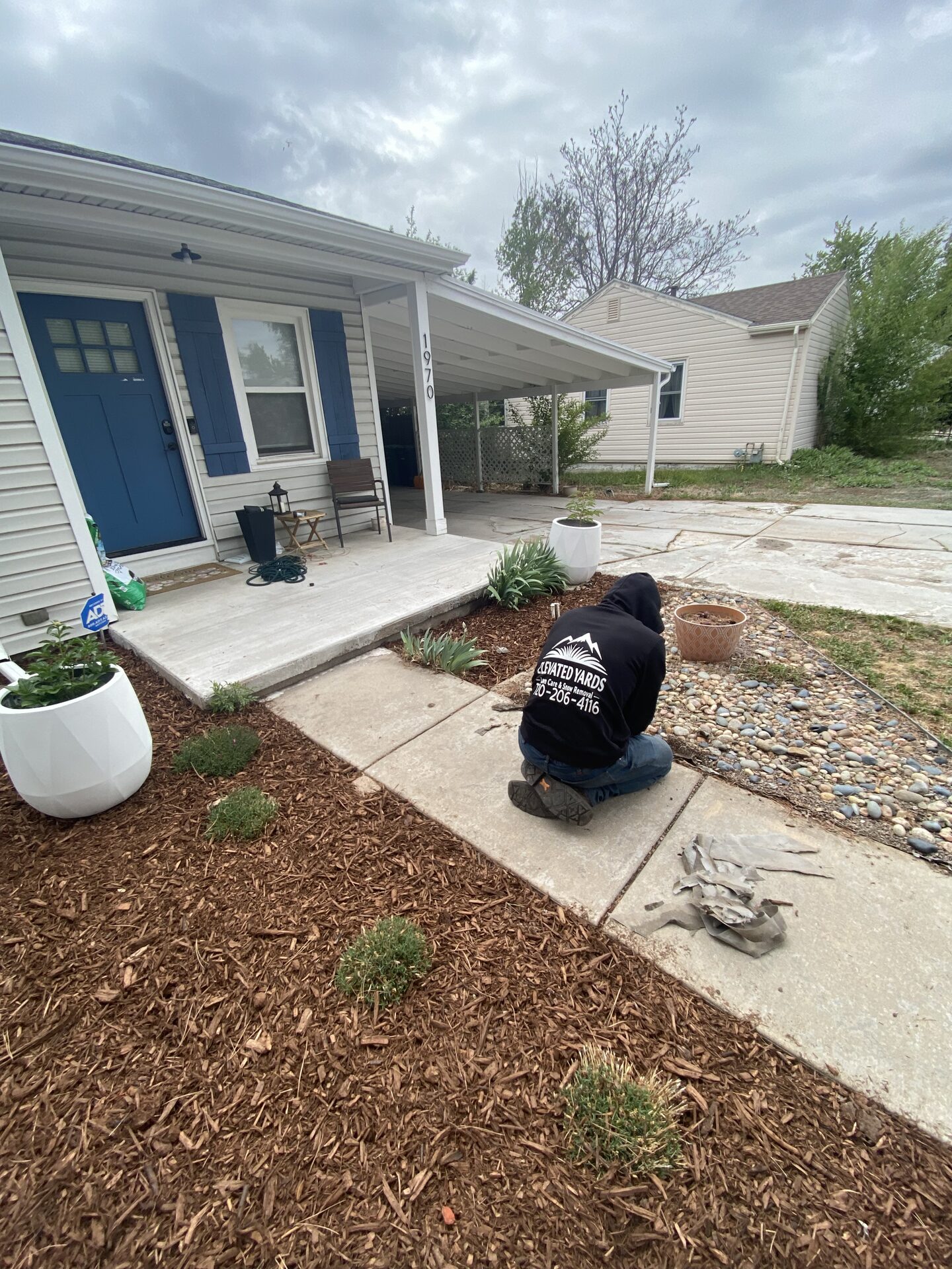 Kyle Rivard working on a front yard project